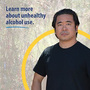 A Veteran standing on a nature trail and looking into the camera. The text reads, “Learn more about unhealthy alcohol use.” 