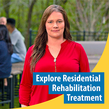 Veteran standing in the forest with text that reads “Explore Residential Rehabilitation Treatment”