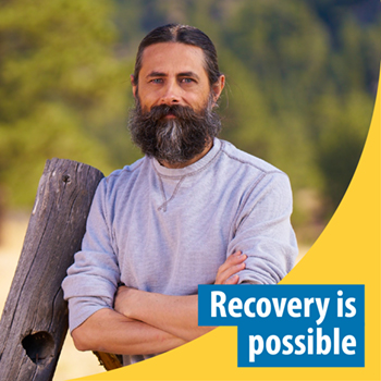 Veteran leaning on a fence. Text reads: Recovery is possible.