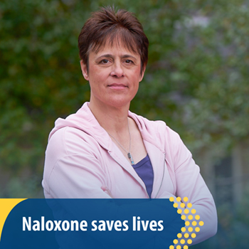 A Veteran standing in front of trees. Text reads: Naloxone saves lives.